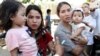 Families of jailed Reuters reporters Wa Lone and Kyaw Soe Oo talk to the media after attending a hearing at Myanmar's Supreme Court in Naypyitaw, Myanmar, March 26, 2019.