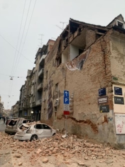 Cars are crushed by falling debris after an earthquake in Zagreb, Croatia, Sunday, March 22, 2020. (Courtesy Jan Pivac)