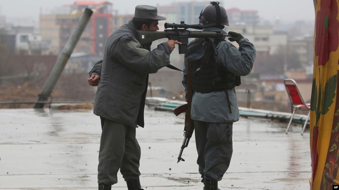 Police soldiers guard during celebrations of Nowruz, the Persian new year, at the Kart-e-Sakhi shrine in Kabul, Afghanistan, March 21, 2017. 