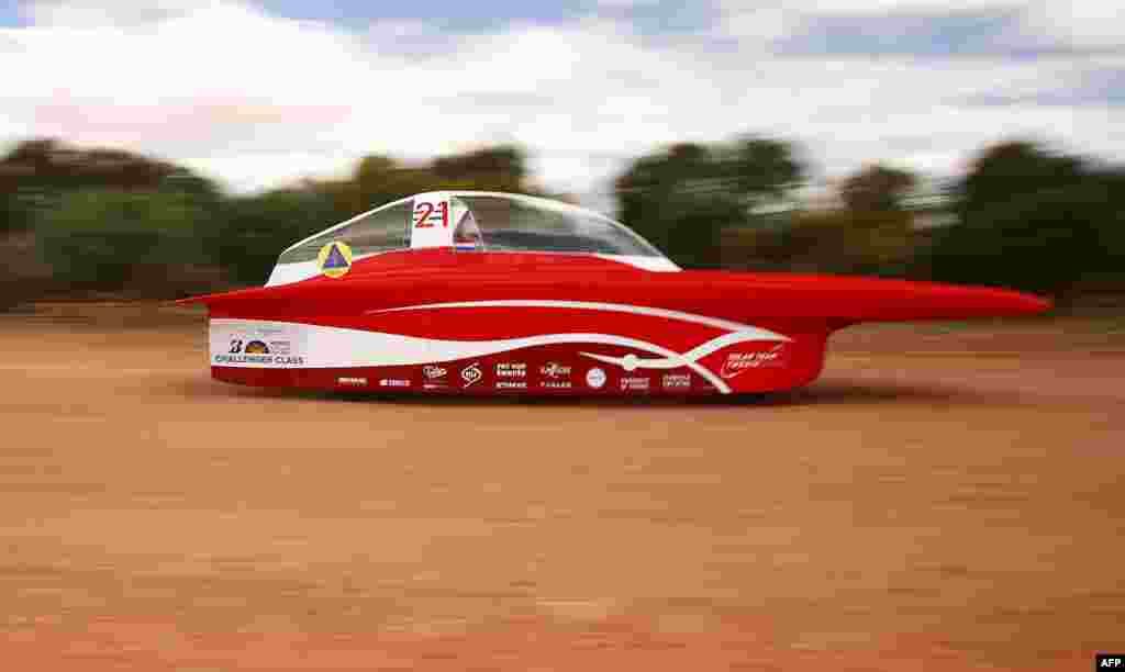 This handout from the World Solar Challenge shows the Solar Team Twente vehicle "RED Shift" of Netherland in action near Coober Pedy on the fourth day of racing. The World Solar Challenge, an epic 3,000-kilometer (1,860-mile) solar car race across outback Australia, has become one of the world’s foremost innovation challenges with teams looking to demonstrate designs that could one day lead to solar-powered cars for consumers that can carry passengers.