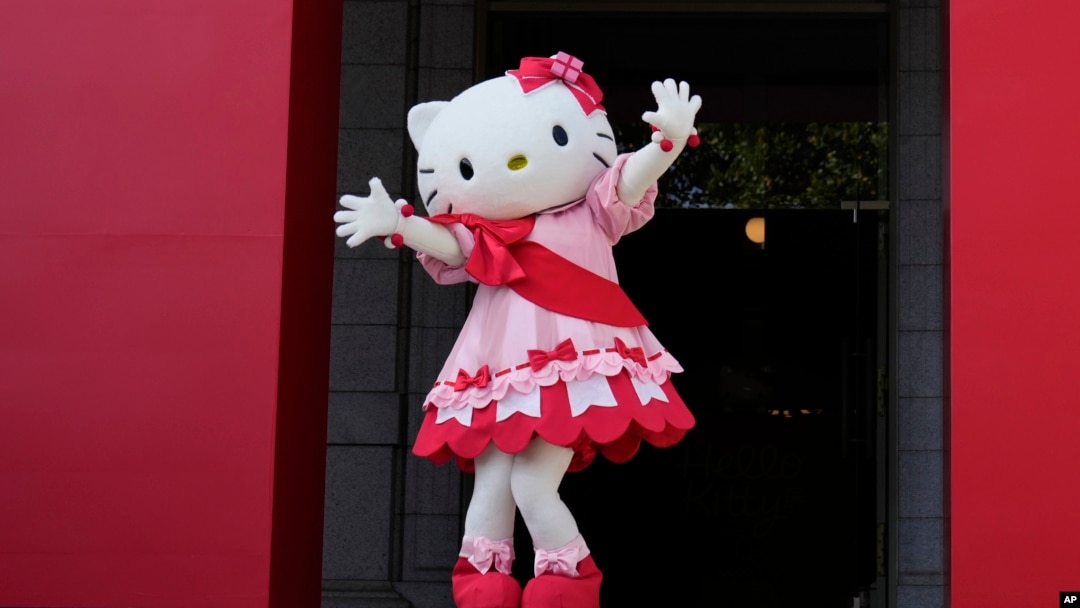 Hello Kitty waves as she appears to attend the opening ceremony of the exhibition "As I change, so does she," marking the 50th anniversary of Hello Kitty at the Tokyo National Museum in Tokyo, Oct. 30, 2024.