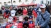 A street vender sells Taiwan flags and caps at a campaign rally of the main opposition Kuomintang (KMT) in Kaohsiung on Jan. 7, 2024, a week before the presidential election.