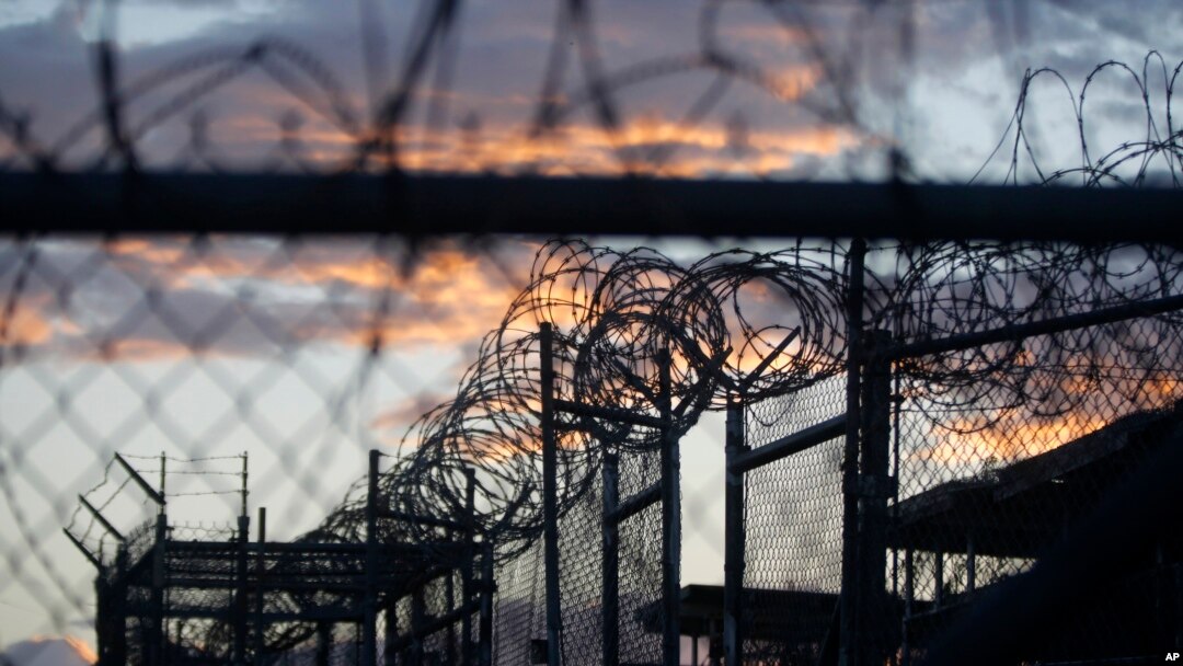 FILE - Dawn arrives at the now-closed Camp X-Ray, which was used as the first detention facility for al-Qaida and Taliban militants who were captured after the Sept. 11 attacks, at the Guantanamo Bay Naval Base, Cuba.