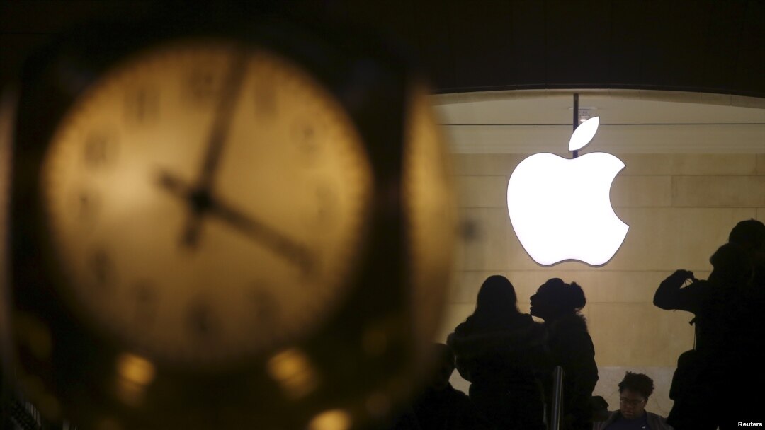 The Apple logo is pictured behind the clock at Grand Central Terminal in the Manhattan borough of New York, Feb. 21, 2016. 