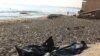 FILE - Bags containing the bodies of migrants who died after their boat capsized off coast of Komas, are seen in the town east of the capital Tripoli, Libya, July 26, 2019. At least 45 migrants died earlier this week in a shipwreck, according to reports. 