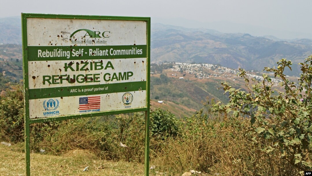 FILE - Picture showing the entrance placard of the Kiziba camp in western Rwanda, Sept. 6, 2016.