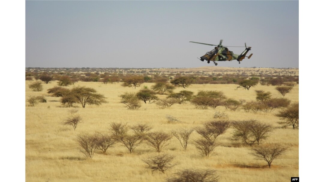 FILE - A Tigre helicopter of France's Barkhane mission in central Mali, is seen as the G5 Sahel anti-jihadist force began operations Nov. 1, 2017.