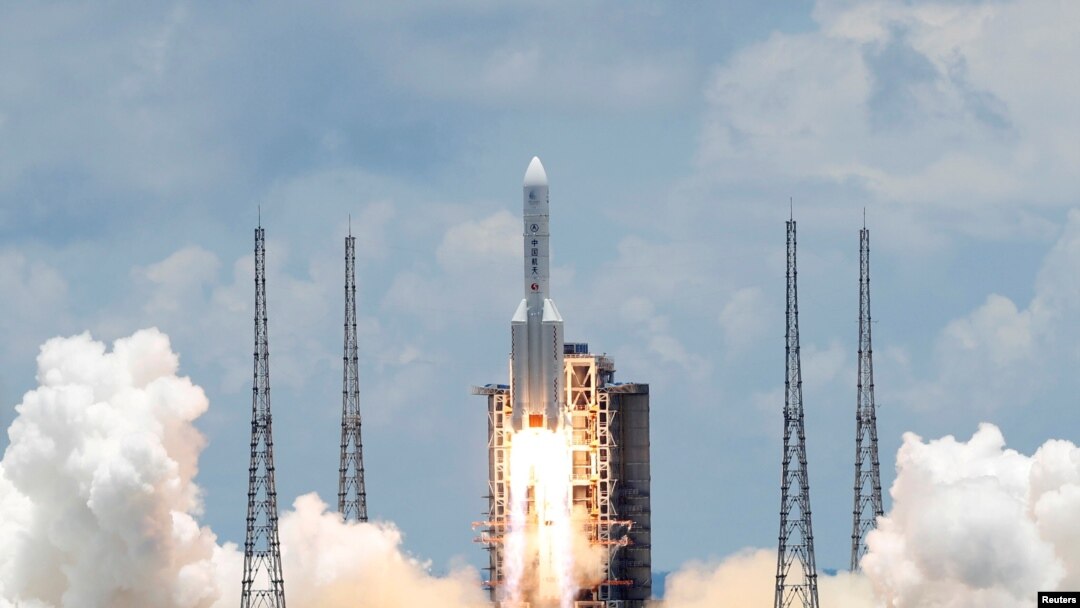 FILE - The Long March 5 Y-4 rocket, carrying an unmanned Mars probe of the Tianwen-1 mission, takes off from Wenchang Space Launch Center in Wenchang, Hainan Province, China, July 23, 2020. 