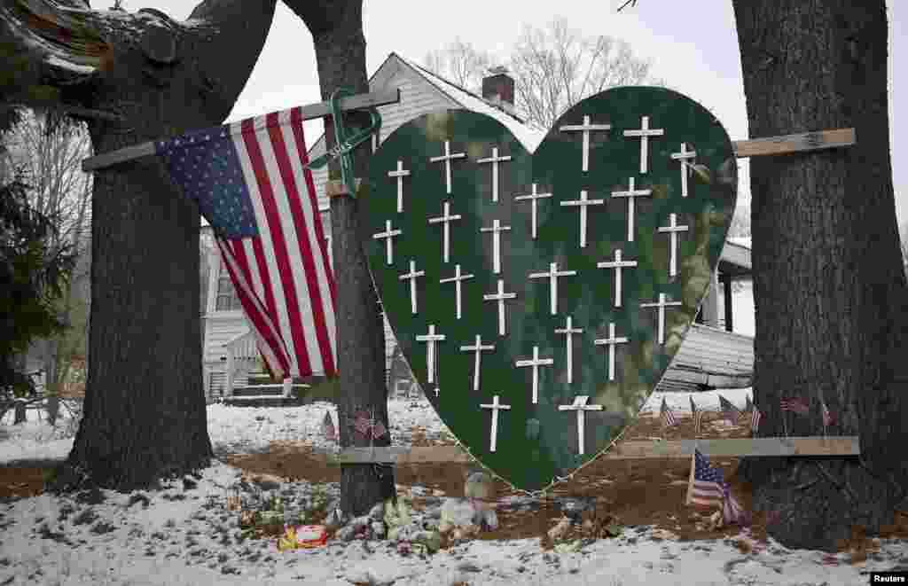 A heart is emblazoned with crosses to commemorate the 26 Sandy Hook Elementary School shooting victims in Newtown, Connecticut. December 14th marks the one-year anniversary of the shooting rampage by a lone gunman.