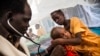 FILE - A doctor examines a boy with tuberculosis at the hospital of Doctors Without Borders in Malakal, South Sudan, June 15, 2016.