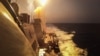 FILE - This handout picture courtesy of the U.S. Navy taken on Oct. 19, 2023, shows the Arleigh Burke-class guided-missile destroyer USS Carney defeating a combination of Houthi missiles and unmanned aerial vehicles in the Red Sea.