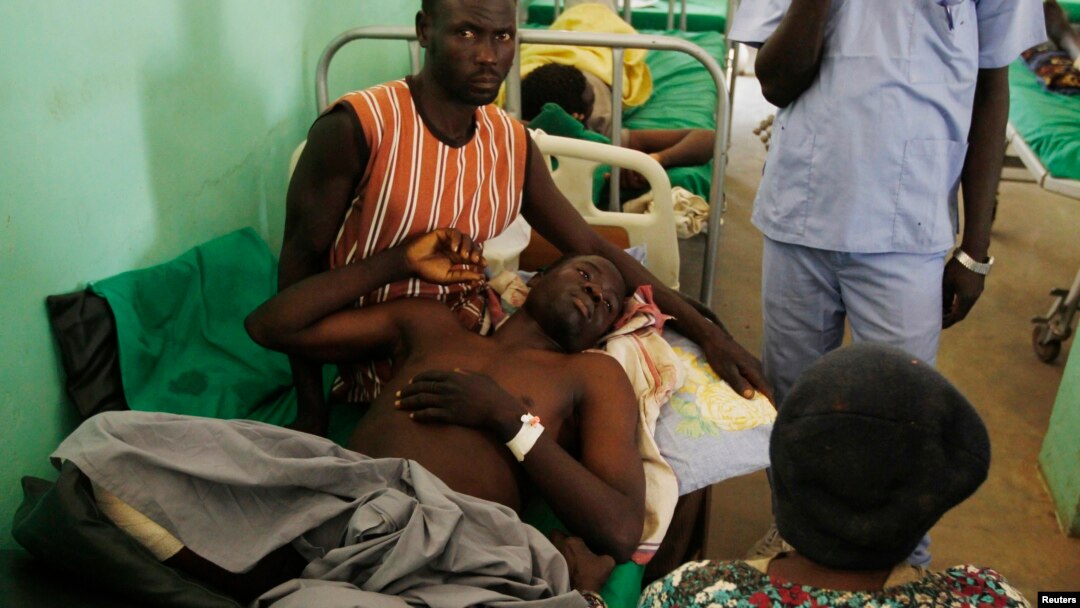 FILE - A Sudan People's Liberation Movement soldier, wounded in a Sudanese air force bombing in South Kordofan, lies in a hospital in Gidel, April 30, 2012.