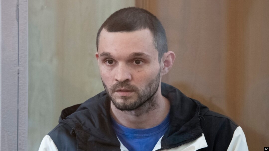 U.S. Army Staff Sgt. Gordon Black sits in a glass cage in courtroom in Vladivostok, Russia, on June 19, 2024. Black was sentenced to three years and nine months in a Russian penal colony.