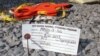 An Aug. 21, 2013 photo shows an identification tag for a dolphin that had died on the Spring Lake N.J. beach and was brought to the Marine Mammal Stranding Center in Brigantine, N.J. for examination. 