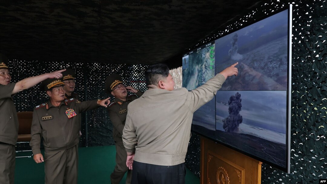 This photo reportedly taken on Sept. 18, 2024, and released from North Korea's official Korean Central News Agency on Sept. 19, 2024, shows North Korean leader Kim Jong Un inspecting the test firing of a new tactical ballistic missile, at an undisclosed location in North Korea.
