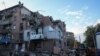 Rescuers work at a site of a residential building hit by a Russian missile strike in Kharkiv, Ukraine, on May 31, 2024.