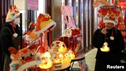A vendor in Shanghai's Yu Garden sells Year of the Snake toy lanterns before the Spring Festival, Jan. 23, 2025.