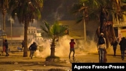 Youth clash with security forces in the central region of Sfax, which has seen weeks of angry demonstrations over a growing waste crisis, on Nov. 9, 2021. 