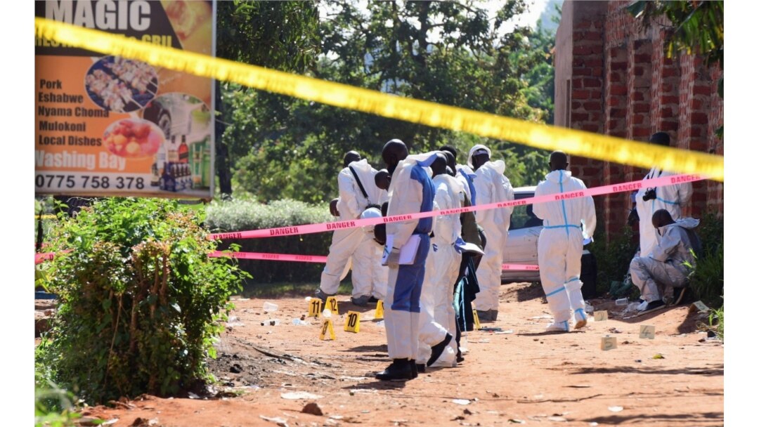 Ugandan explosives experts secure the scene of an explosion in Komamboga, a suburb on the northern outskirts of Kampala, Uganda, Oct. 24, 2021.