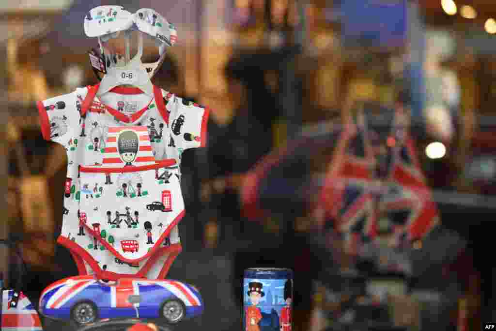 Souvenirs are seen on display in a shop window in Windsor as excitement builds ahead of the birth of the child of Britain's Prince Harry and Meghan, Duke and Duchess of Sussex.