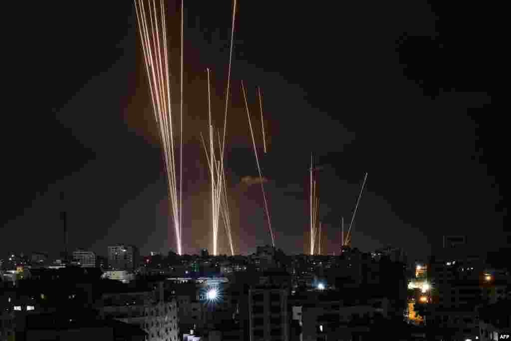 A salvo of rockets is fired by Palestinian militants from Gaza City toward Israel, Oct. 7, 2023. At least 70 people were reported killed in Israel, while Gaza authorities released a death toll of 198 in the bloodiest escalation in the wider conflict since May 2021, with hundreds more wounded on both sides.