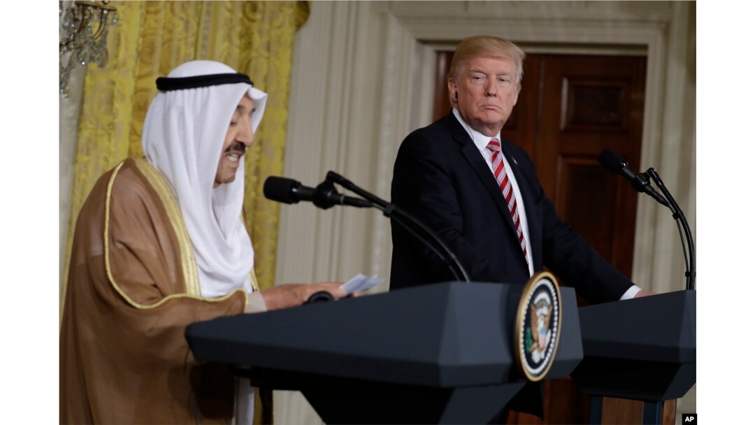 President Donald Trump listens while Kuwait leader Sheikh Sabah Al-Ahmad Al-Jaber Al-Sabah speaks during a news conference at the White House in Washington, Sept. 7, 2017.