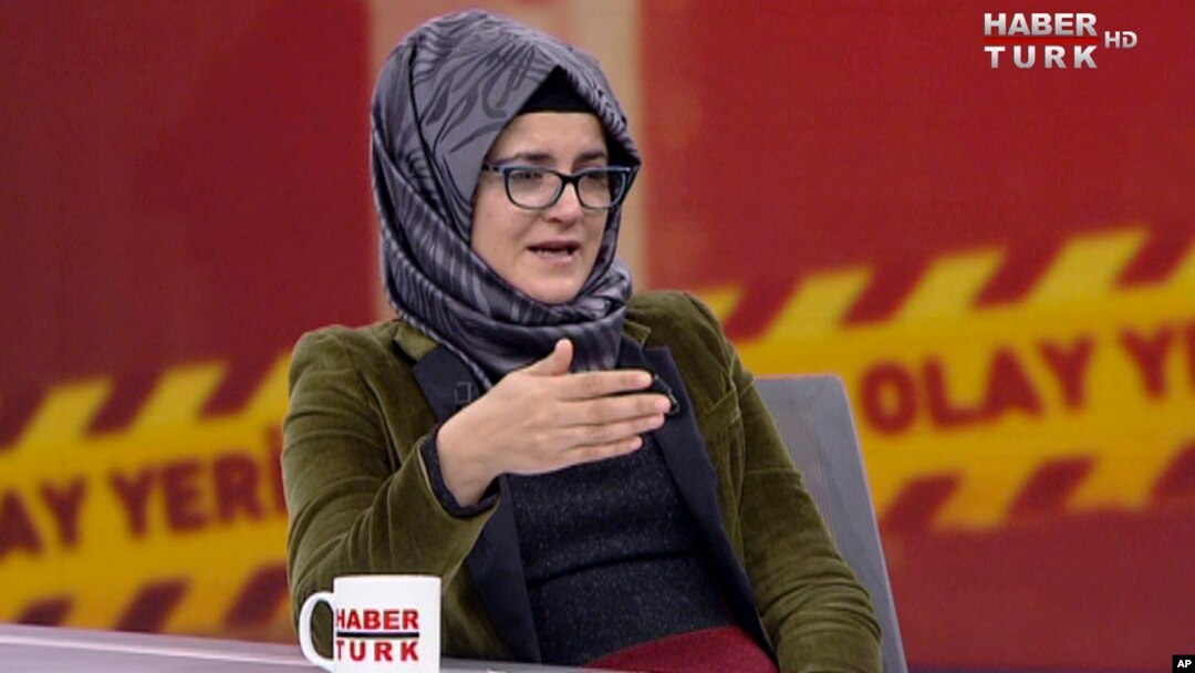 In this image from TV, Hatice Cengiz, who is Turkish, reacts during an interview on Turkish television channel HaberTurk, Oct. 26, 2018, about the day her fiance, Saudi journalist Jamal Khashoggi entered the Saudi Arabia Consulate on Oct. 2, and was killed inside.
