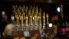 FILE - Oscar-shaped chocolates are pictured at a preview of the food and decor for the 87th Academy Awards' Governors Ball at the Ray Dolby ballroom in Hollywood, Calif., February 4, 2015. One marketing firm has promised $200,000 gift bags for celebrities