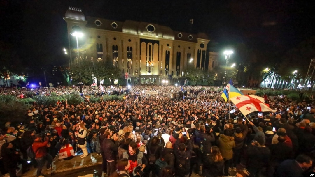 Demonstrators wave Georgian and Ukrainian national flags during an opposition protest against the results of the parliamentary election in Tbilisi, Georgia, Oct. 28, 2024.