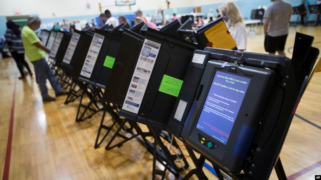 FILE - An electronic voting machine in Columbus, Ohio, Nov. 3, 2015. Democrats and Republicans compete in primaries and caucuses in at least 11 states and one U.S. territory on Tuesday.