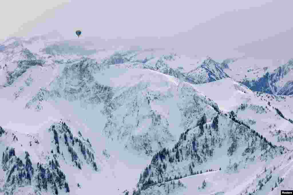 A balloon takes part in the 45th International Hot Air Balloon Festival near Chateau-d'Oex, Switzerland.