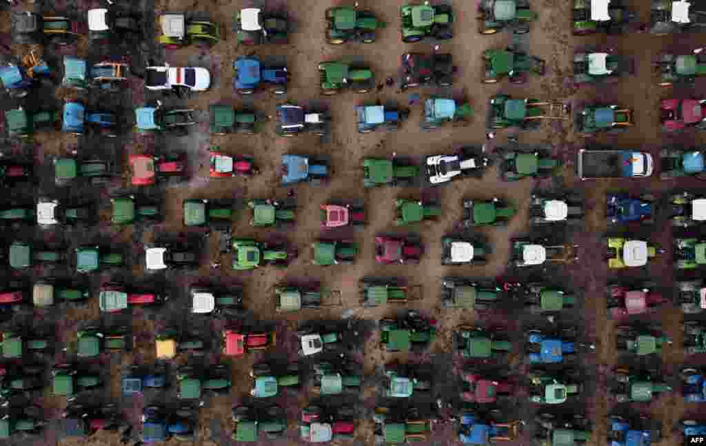 This aerial photo shows farmers' tractors gathered during a demonstration to demand fairer prices for their produce, in Antequera, Spain.