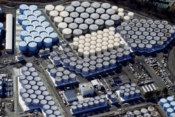 An aerial view shows the storage tanks for treated water at the tsunami-crippled Fukushima Daiichi nuclear power plant in Okuma town, Fukushima prefecture, on February 13, 2021.