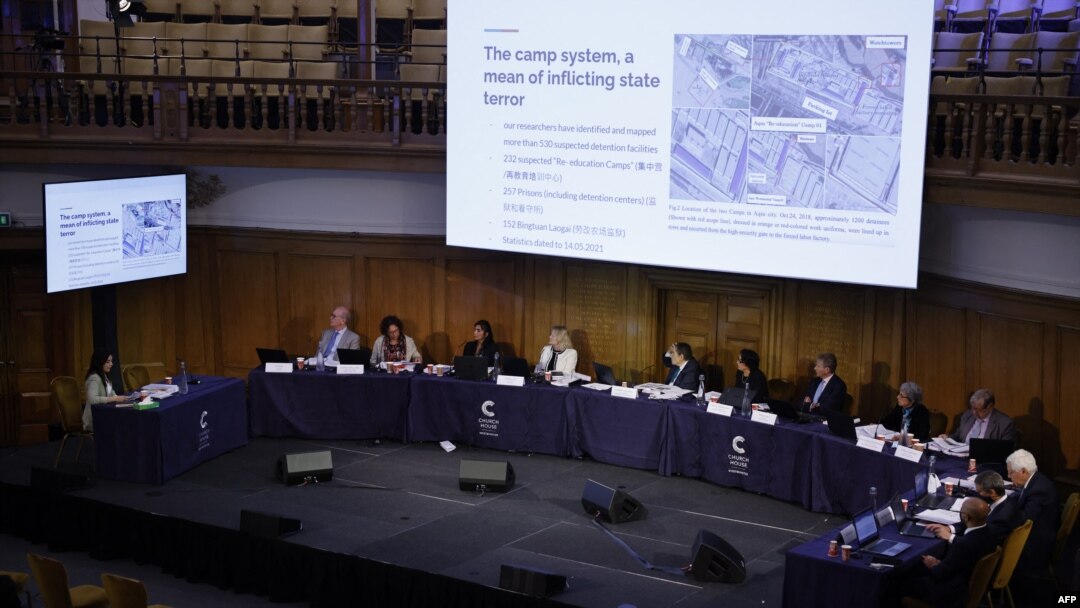The panel is shown images of what witnesses say are re-education camps in China on the first day of hearings at the "Uyghur Tribunal", a panel of UK-based lawyers and rights experts investigating alleged abuses in China, in London on June 4, 2021.