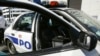 Policajac Nju Orleansa pored svog patrolnog vozila, 11. septembar, 2005.(Foto: AP/Anja Niedringhaus)