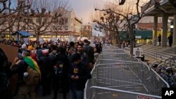 People protest the appearance of Breitbart News editor Milo Yiannopoulos, Feb. 1, 2017, in Berkeley, Calif. Yiannopoulos is on the last stop of a tour aimed at defying what he calls an epidemic of political correctness.