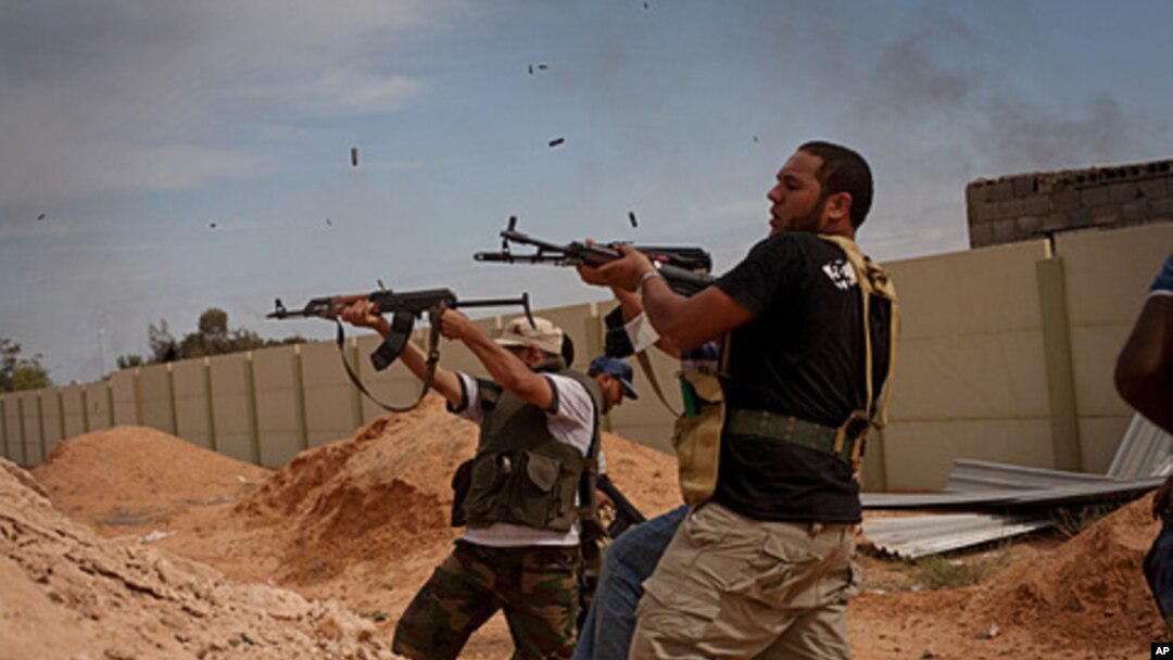 Libyan provisional government fighters attacking pro-Gadhafi forces in Sirte, Oct. 7, 2011.