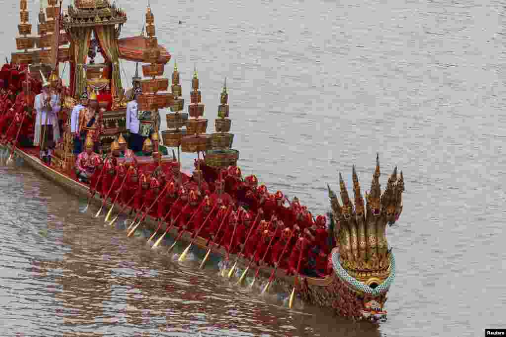 Thai oarsmen take part in a rehearsal of Thailand's King Maha Vajiralongkorn's royal barge procession to mark his 72nd birthday, along the Chao Phraya River in Bangkok, Thailand.