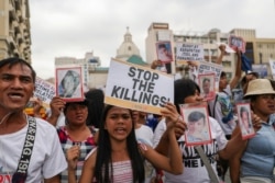 Filipino activists and relatives of people killed in the country's war on drugs hold a rally in observance of Human Rights Day in Manila, on December 10, 2019. Eloisa Lopez/Reuters