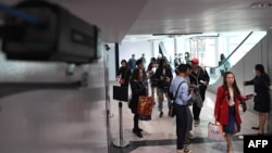 A thermal scanner monitors arriving passengers at Phnom Penh international airport in Cambodia, Jan. 22, 2020.