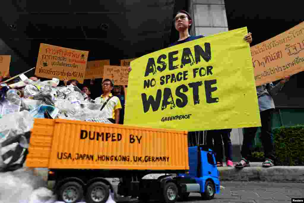 Greenpeace activists protest in front of the Foreign Ministry ahead of the 34th ASEAN summit in Bangkok, Thailand.