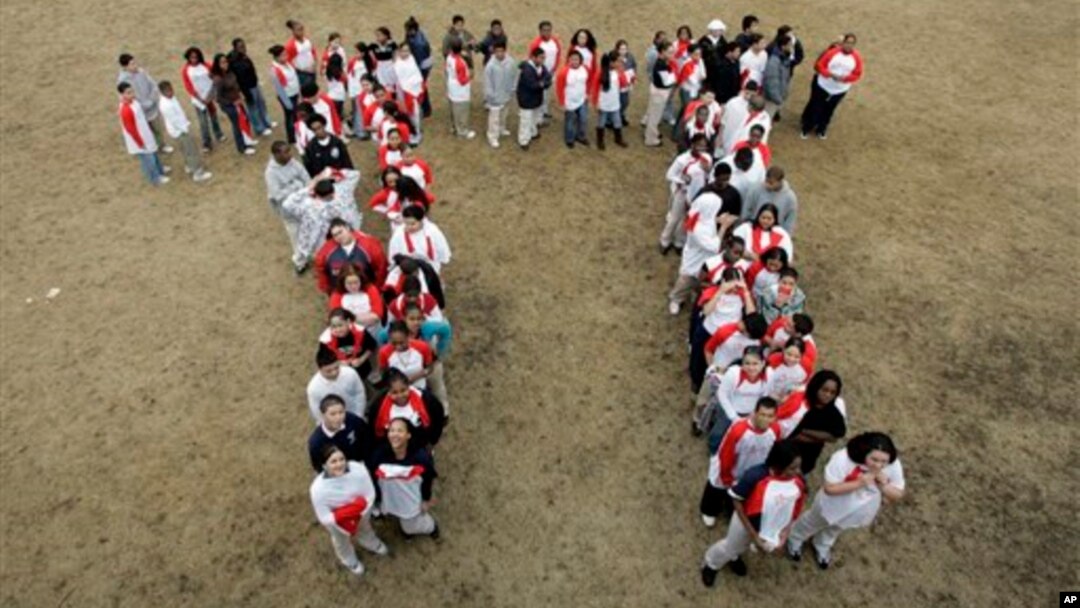 Students gather to form the "Pi" symbol, a Greek letter.