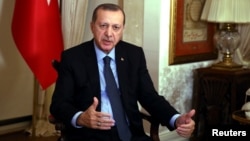 Turkish President Tayyip Erdogan responds to a question during an interview in Istanbul, Dec. 19, 2016.