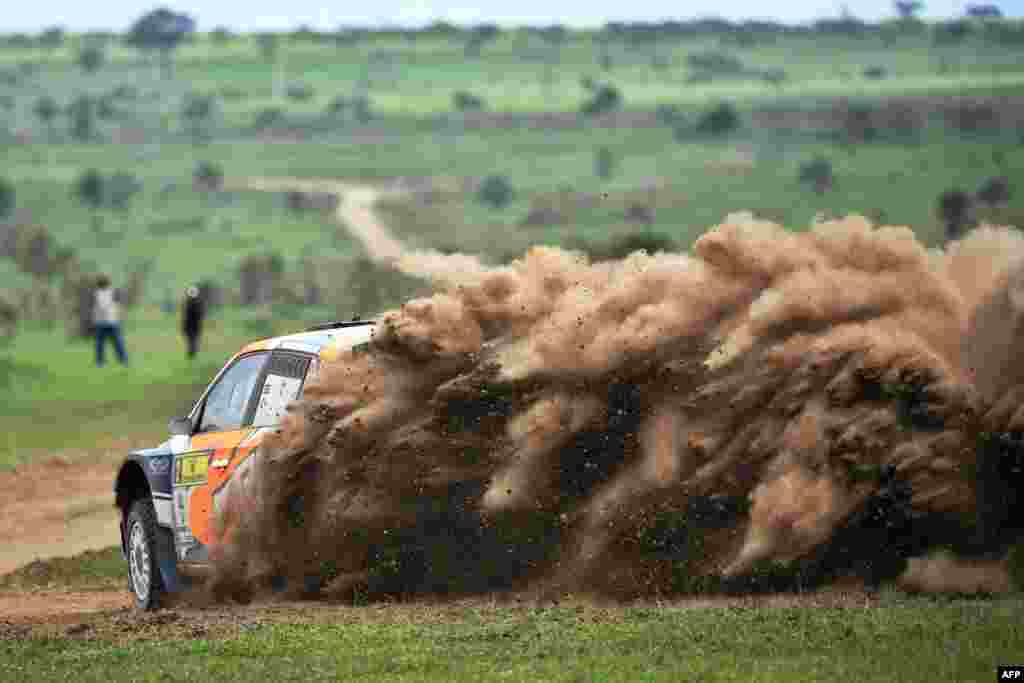 Kenya’s Manvir Baryan and his British navigator Drew Sturrock kick up a dust cloud in the Skoda Fabia R5 as he negotiates a turn, during the second day of the Safari rally at Soysambu ranch near Kenya's lakeside town of Naivasha, July 6, 2019.