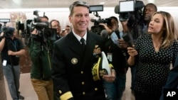 Rear Adm. Ronny Jackson, President Donald Trump's choice to be secretary of the Department of Veterans Affairs, leaves a Senate office building after meeting individually with some members of the committee that would vet him for the post, on Capitol Hill in Washington, April 24, 2018.