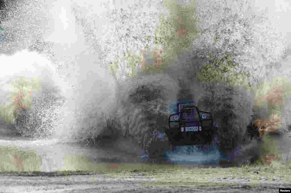A participant attends a regional tractor racing competition Bizon-Track-Show outside of Rostov-on-Don, Russia.