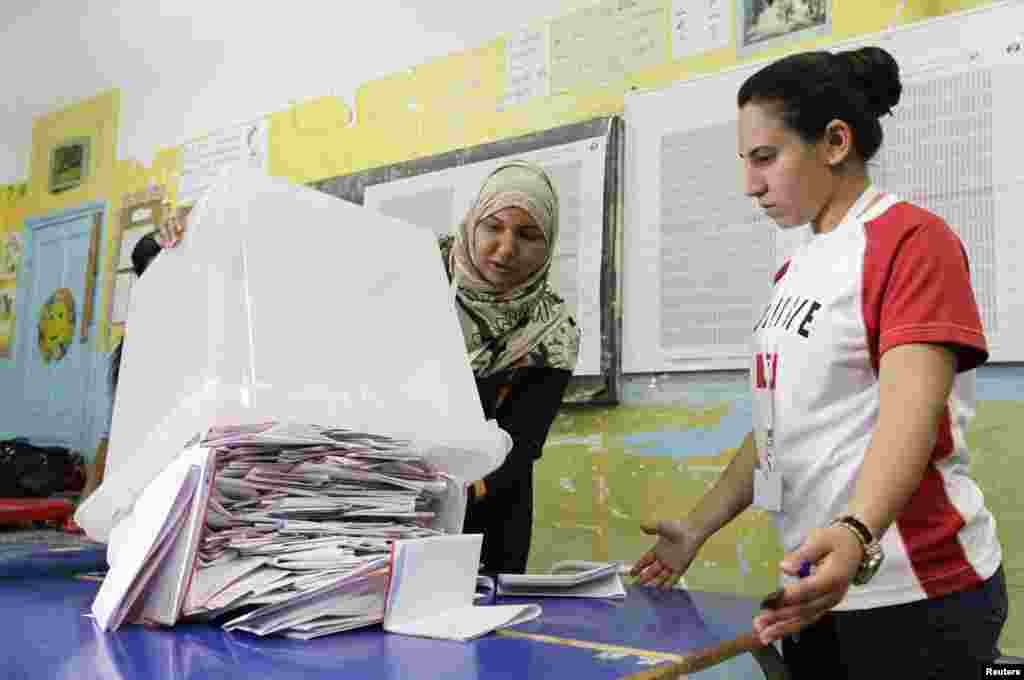 Tunisians voted on Sunday in parliamentary elections that finally bring democracy within their reach, almost four years after an uprising cast out autocrat Zine El-Abidine Ben Ali and inspired the "Arab Spring" revolts, Tunisia, Oct. 26, 2014.