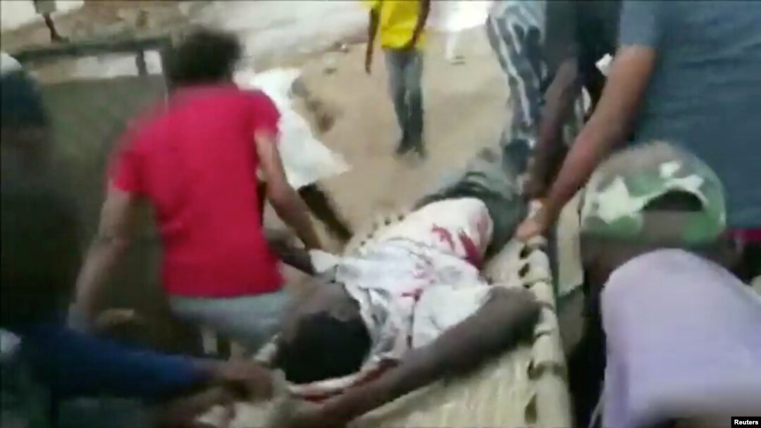 An injured man is carried on a stretcher during protests in Khartoum, Sudan, June 3, 2019 in this image taken from a video obtained from social media.