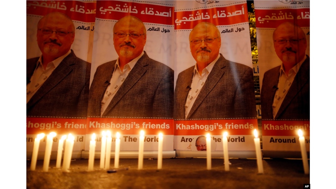 Candles, lit by activists, protesting the killing of Saudi journalist Jamal Khashoggi, are placed outside Saudi Arabia's consulate, in Istanbul, during a candlelight vigil, Oct. 25, 2018.