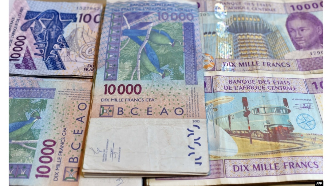 FILE - CFA franc banknotes by the Central Bank of West African States are seen in N'djamena, Chad, April 9, 2016.